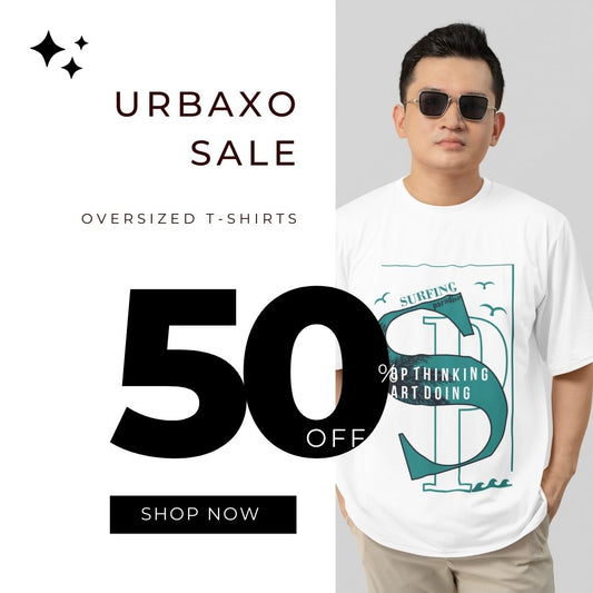 Model wearing Urbaxo California Oversized T-shirt on the beach, showcasing relaxed fit