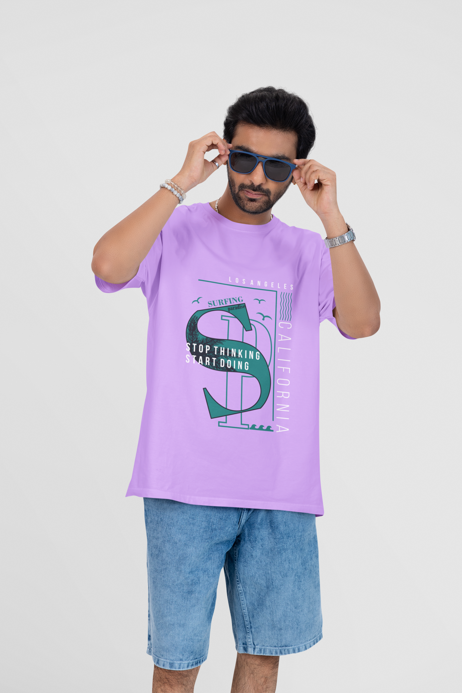 Oversized lavender tee with subtle "California" print on the front, designed by Urbaxo for a calm, laid-back aesthetic.