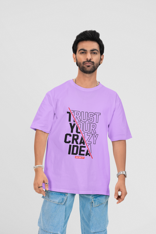Oversized lavender T-shirt with "Crazy Idea" printed on the front, designed for bold thinkers and laid-back style.