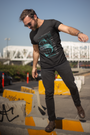  TUY's 'California' Regular Fit Black T-shirt in Urbaxo brings relaxed coastal energy to your wardrobe with a classic fit and minimalist design