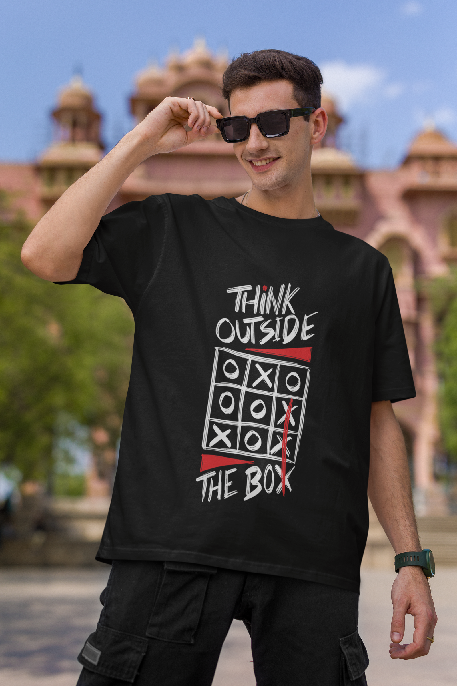 A trendy oversized T-shirt from Urabxo, featuring a bold "Think Out Of The Box" graphic. A perfect choice for those who embrace creativity and individuality in their style