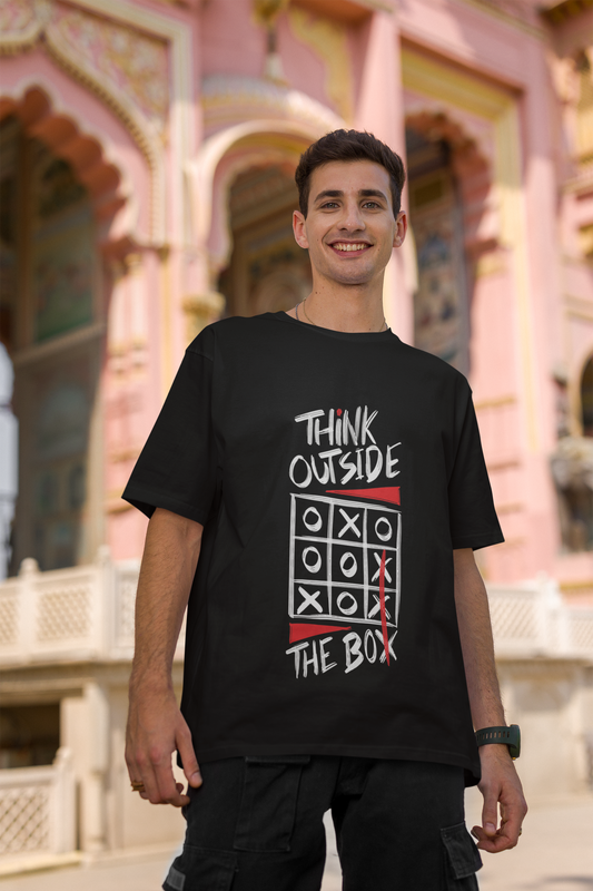 An oversized T-shirt by Urabxo with an inspiring "Think Out Of The Box" print. A perfect piece for making a statement and embracing a creative mindset