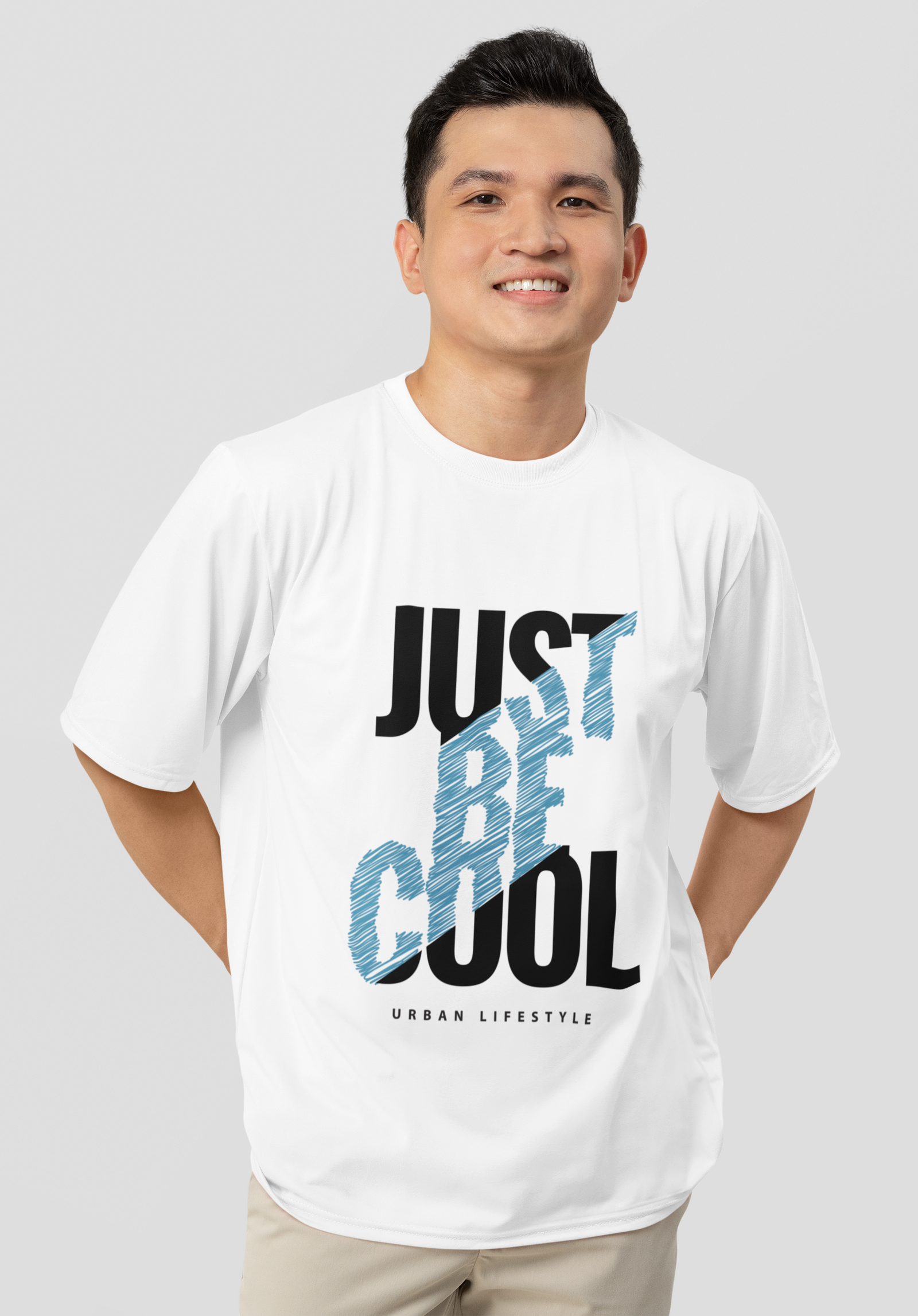 White oversized t-shirt by Urbaxo featuring bold "Just Be Cool" print, perfect for casual outfits